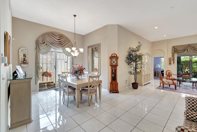 dining room with arched walkways, recessed lighting, light tile patterned flooring, a chandelier, and baseboards