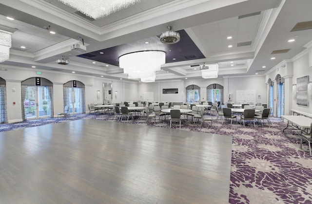 interior space featuring arched walkways, recessed lighting, wood finished floors, and crown molding