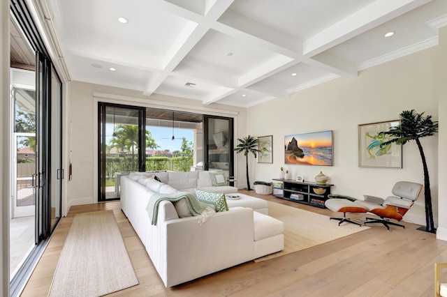 living area with light wood-style floors, coffered ceiling, beam ceiling, and recessed lighting