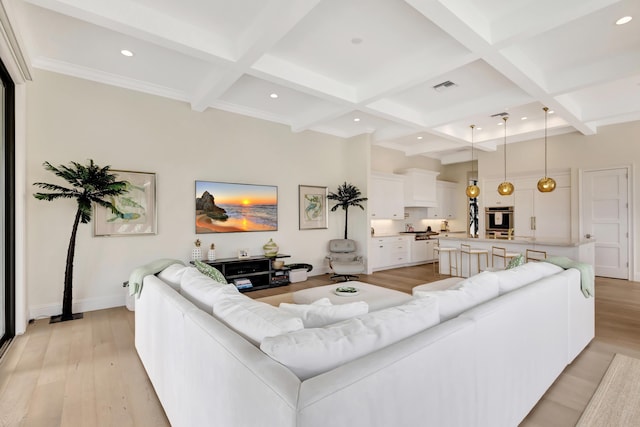 living room with coffered ceiling, light wood-type flooring, visible vents, and beamed ceiling