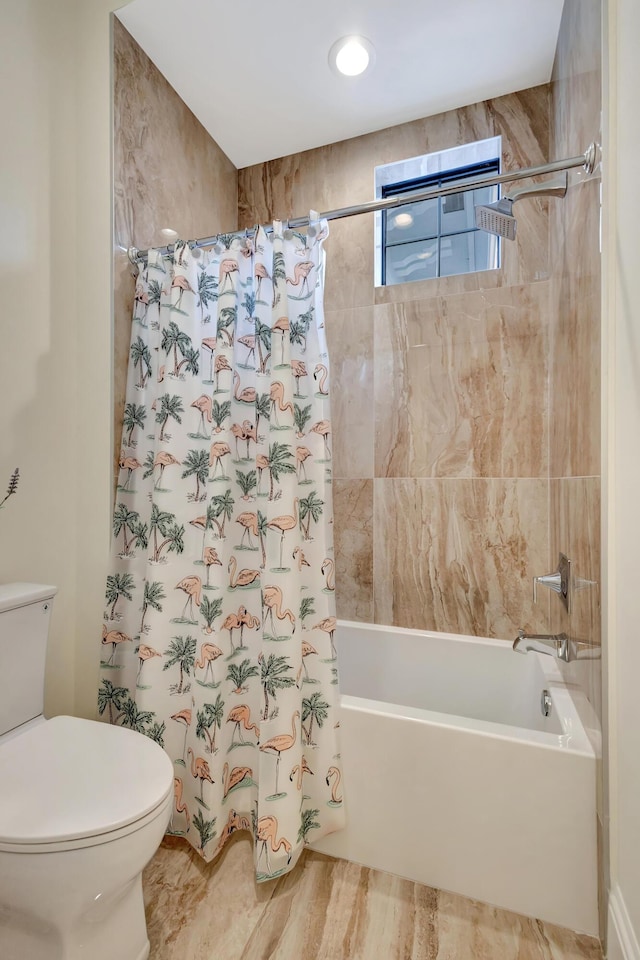 full bathroom featuring toilet and shower / tub combo with curtain