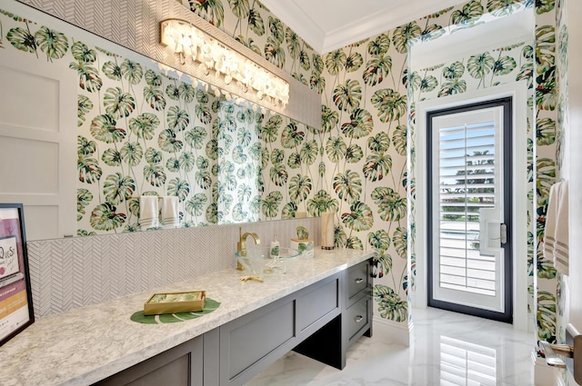 bathroom with wallpapered walls, decorative backsplash, marble finish floor, crown molding, and vanity