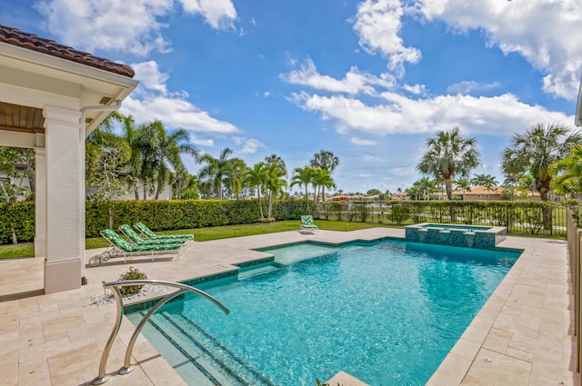 view of swimming pool with a pool with connected hot tub and a patio