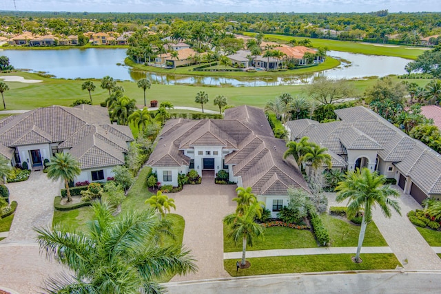 bird's eye view with a water view and a residential view