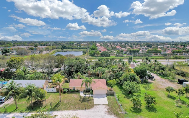 birds eye view of property with a residential view and a water view