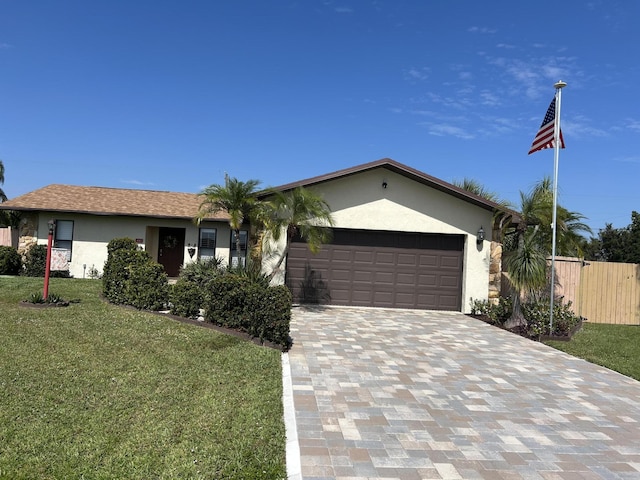 ranch-style house featuring a garage, stucco siding, fence, a front lawn, and decorative driveway
