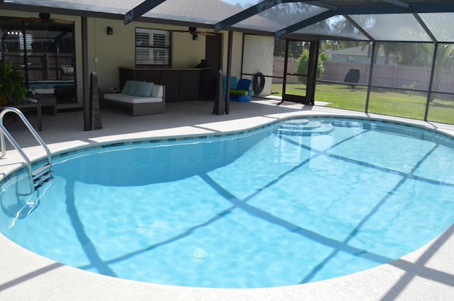 view of swimming pool with a patio, fence, a ceiling fan, and a fenced in pool