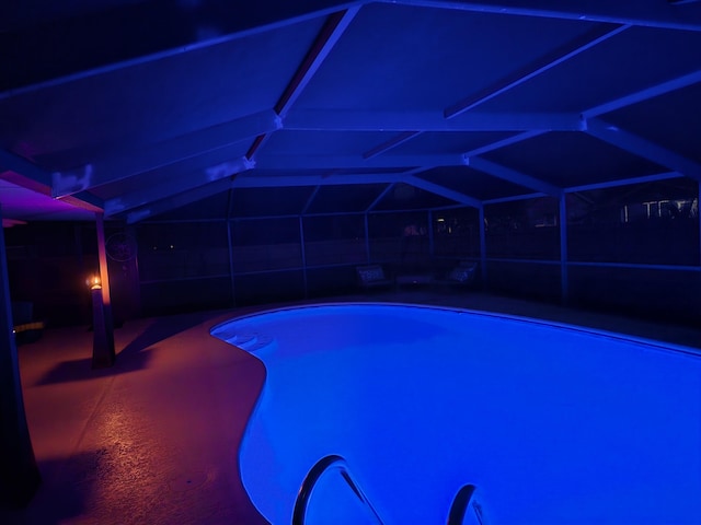 pool with a patio area and a lanai