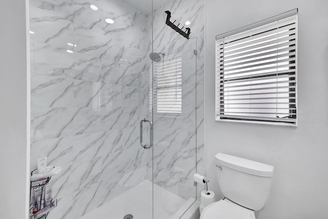 full bathroom with toilet and a marble finish shower