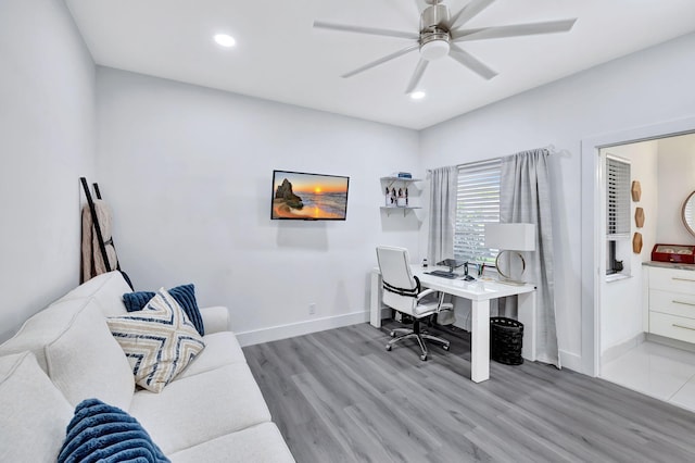 home office featuring ceiling fan, recessed lighting, baseboards, and light wood-style floors