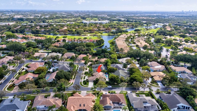 bird's eye view featuring a water view and a residential view