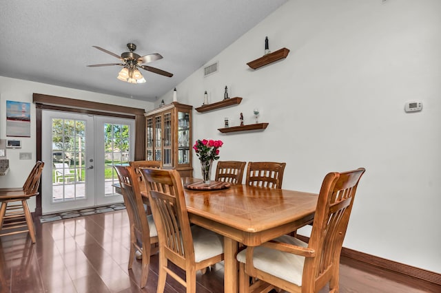 tiled dining space featuring baseboards, visible vents, a ceiling fan, a textured ceiling, and french doors