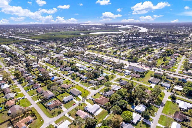 birds eye view of property featuring a water view and a residential view