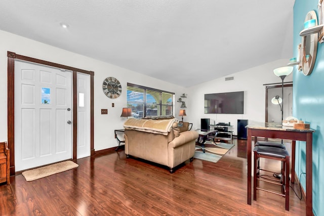 living room with dark wood-style floors, visible vents, vaulted ceiling, and baseboards