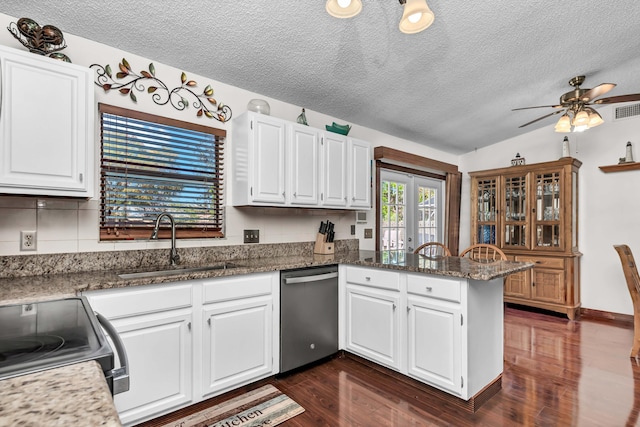kitchen with a peninsula, a sink, white cabinets, and dishwasher