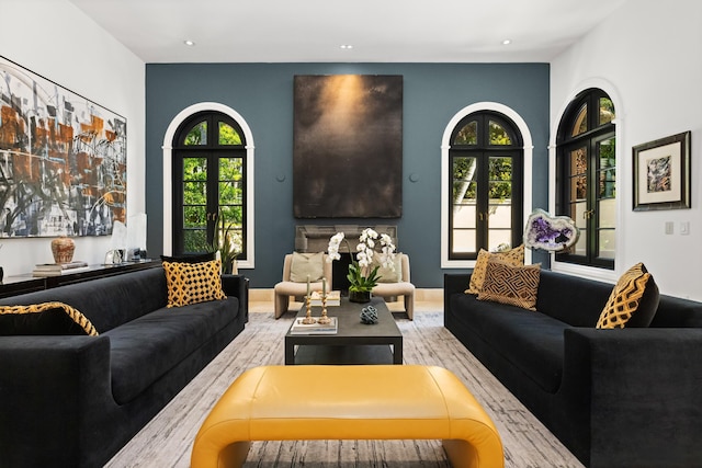 living area featuring recessed lighting and french doors