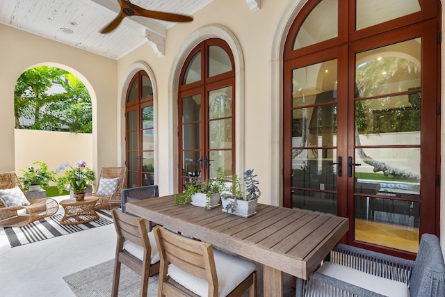 view of patio with a ceiling fan, french doors, and outdoor dining area