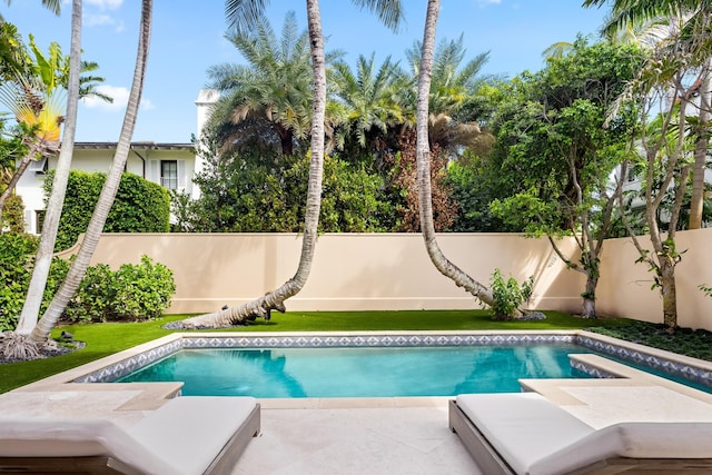 view of pool featuring a patio area, a fenced backyard, and a fenced in pool