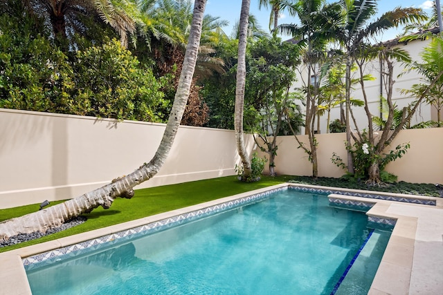 view of swimming pool featuring a fenced in pool and a fenced backyard