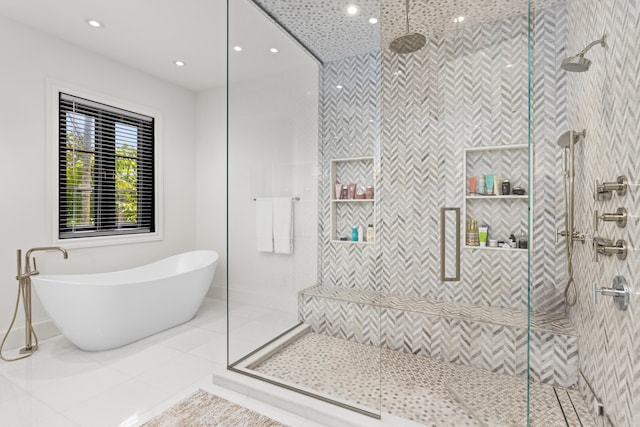 full bathroom with recessed lighting, a stall shower, tile patterned floors, and a soaking tub