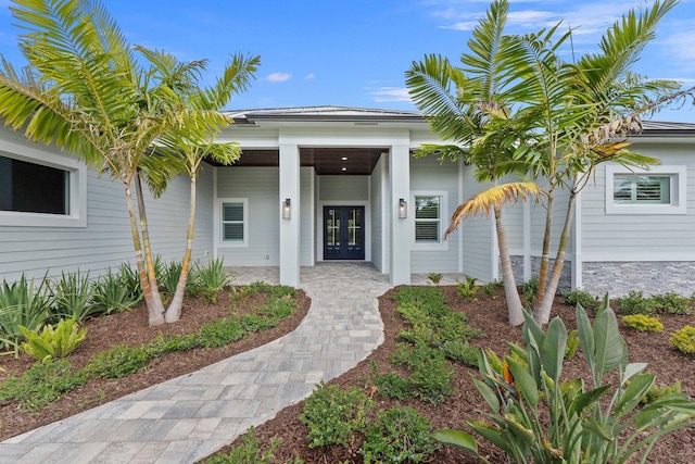 entrance to property featuring french doors