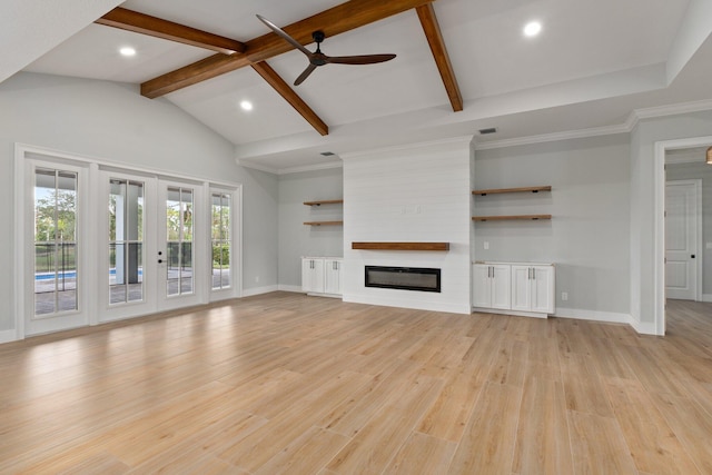 unfurnished living room with light wood finished floors, a fireplace, beam ceiling, and baseboards