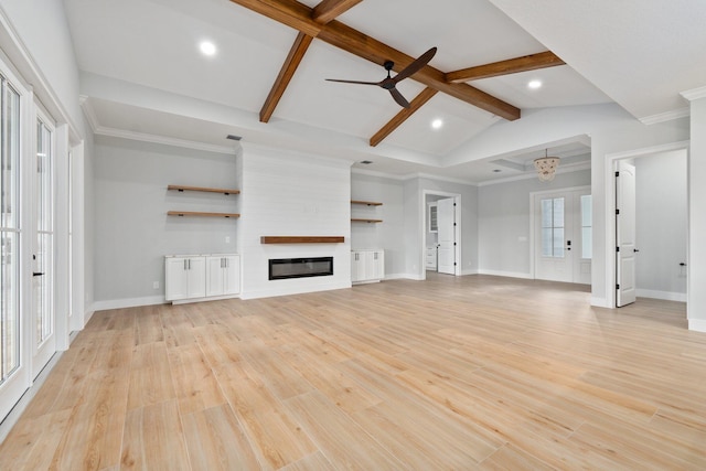 unfurnished living room featuring light wood-type flooring, a large fireplace, vaulted ceiling with beams, and baseboards