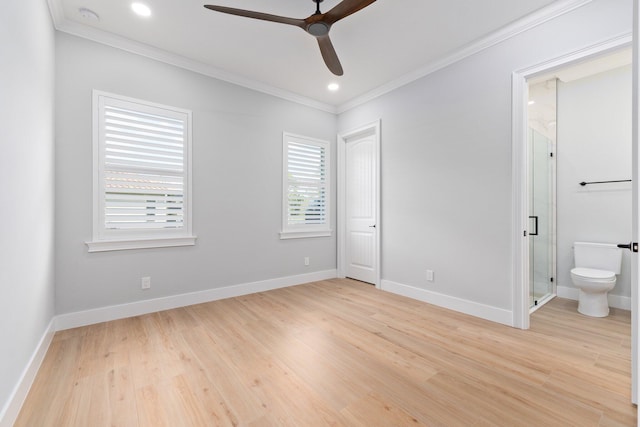 unfurnished bedroom featuring ornamental molding, light wood-style flooring, and baseboards