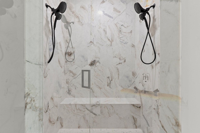 room details with a marble finish shower