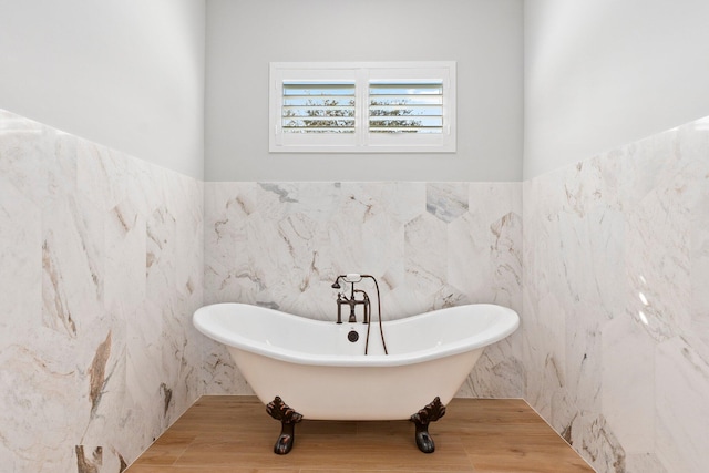 bathroom with a soaking tub