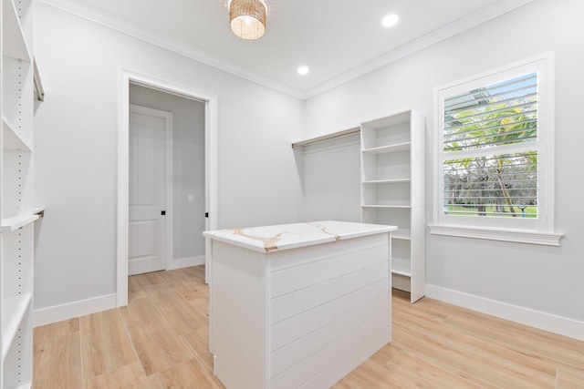 walk in closet with light wood-type flooring