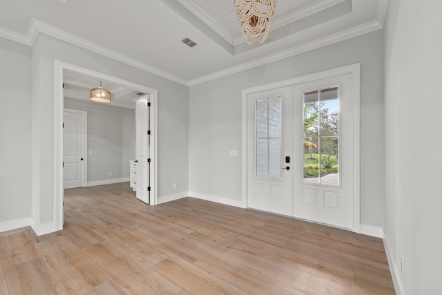 foyer entrance with a tray ceiling, french doors, crown molding, visible vents, and light wood-type flooring