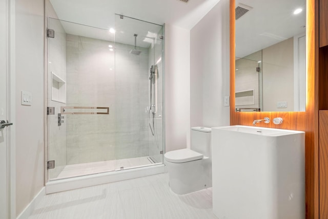 bathroom featuring toilet, a shower stall, visible vents, and tile patterned floors