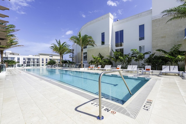 community pool with a patio area