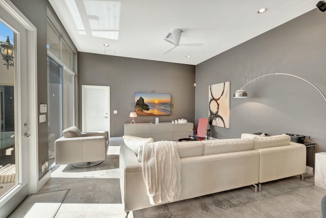 living room with a ceiling fan and recessed lighting