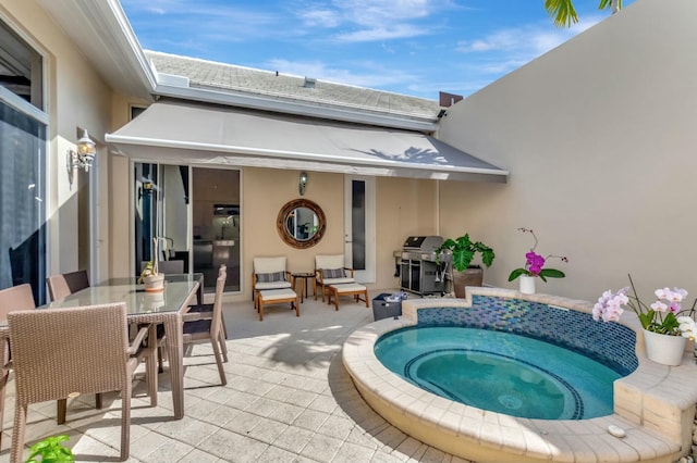 view of pool featuring outdoor dining area, a patio area, area for grilling, and an in ground hot tub