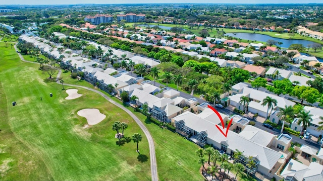 birds eye view of property with a water view and a residential view