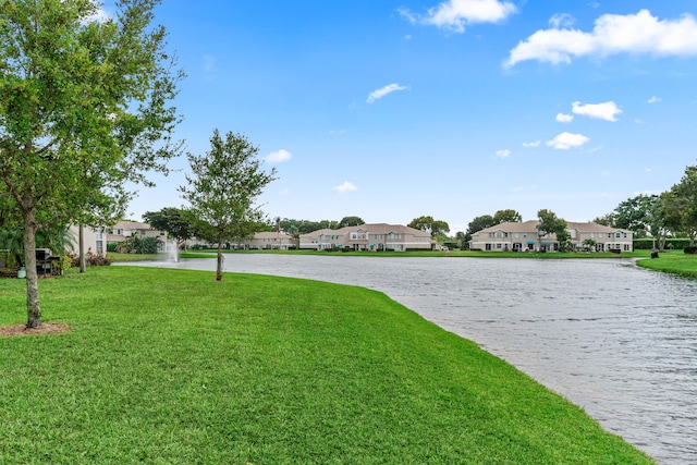 view of yard with a water view and a residential view