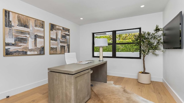 office featuring baseboards, recessed lighting, and light wood-style floors