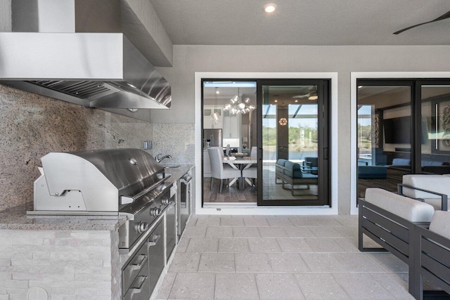 view of patio with a sink and area for grilling