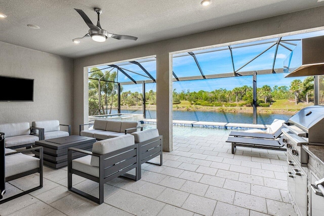 view of patio with an outdoor kitchen, a lanai, an outdoor hangout area, a water view, and a grill