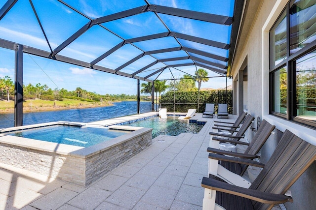 outdoor pool featuring a water view, a lanai, a patio, and an in ground hot tub