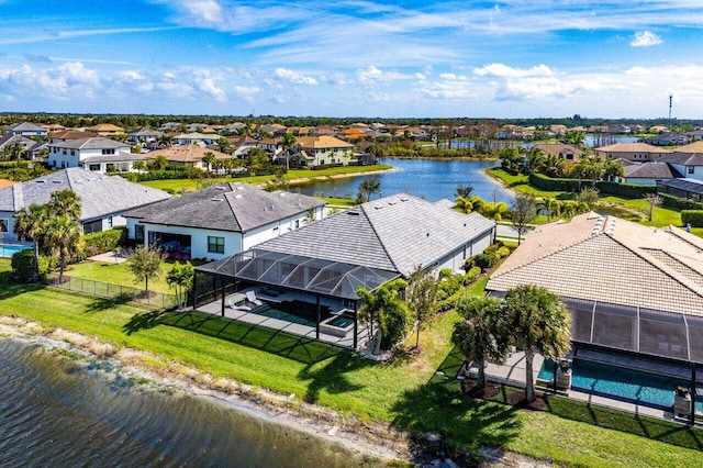 bird's eye view featuring a residential view and a water view