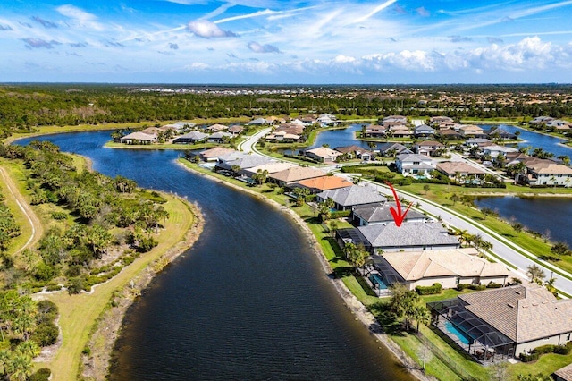 aerial view with a water view and a residential view