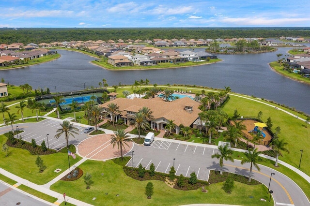 bird's eye view with a water view and a residential view