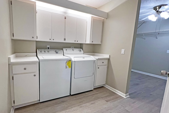 3636 Whitehall Dr Unit 402A, West Palm Beach, FL 33401 - washroom with cabinet space, washer and dryer, light wood finished floors, baseboards, and a ceiling fan