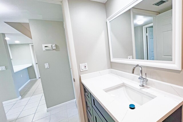 3636 Whitehall Dr Unit 402A, West Palm Beach, FL 33401 - bathroom featuring tile patterned floors, vanity, and baseboards