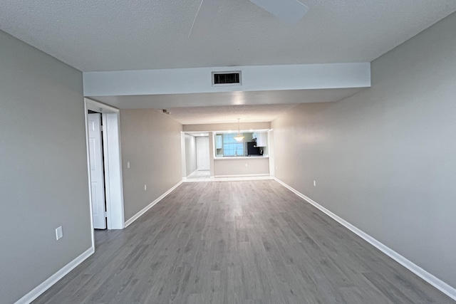 3636 Whitehall Dr Unit 402A, West Palm Beach, FL 33401 - unfurnished room featuring wood finished floors and baseboards