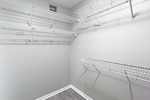3636 Whitehall Dr Unit 402A, West Palm Beach, FL 33401 - spacious closet featuring wood finished floors