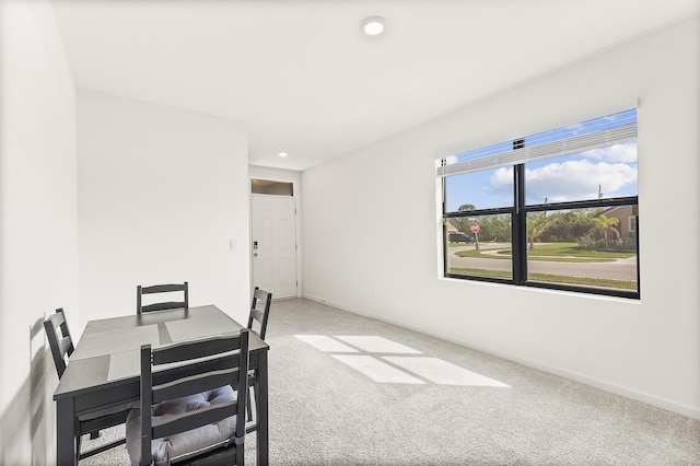 dining space featuring carpet floors, baseboards, and recessed lighting